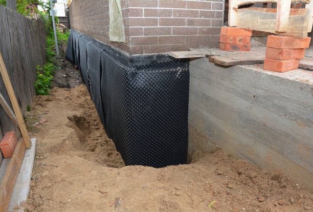 Happy homeowners after waterproofing job in Constantine